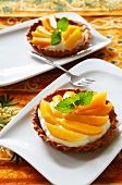 Fruit tartlets topped with sliced peaches