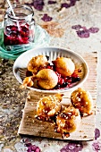 Banana doughnuts with berries and maple syrup