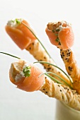 Crisp pastry straws with black cumin and smoked salmon