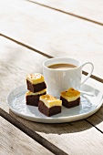 Cheesecake brownies with a cup of coffee