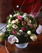 Bouquet with roses, freesias and ranunculus