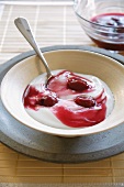 A dessert of yoghurt with cherries