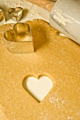 Cutting out heart-shaped biscuits