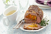 Rolled pork joint stuffed with dried apricots and leek