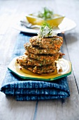 Green spelt burgers, stacked