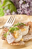 Boiled egg with dill and herring