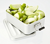 Apple wedges in a metal tin