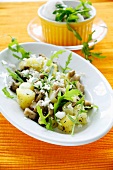 Pan-fried potatoes and mushrooms with rocket and sheep's cheese
