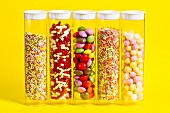 Colourful sugar decorations in sealable plastic tubes