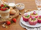 White chocolate cupcakes with strawberries and pistachios