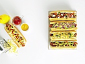 Five hot dogs with assorted toppings