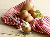 Oven-baked potatoes with herb dip