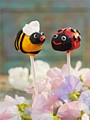 Cake pops decorated to look like a bee and a ladybird