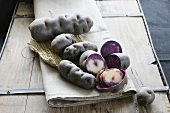 Violet truffle potatoes, whole and halved
