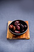 Kalamata olives in a small dish