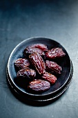 Medjool dates in a small bowl