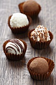 Chocolate truffles on brown wooden table