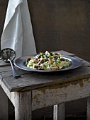 Mushroom risotto on a weathered wooden table