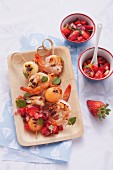 Langoustine skewers with melon and strawberry salsa