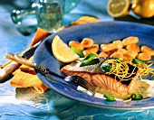 Salmon with basil sauce and lemon zest