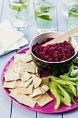 Beetroot dip with crisps and celery