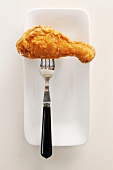 A Fried Drumstick on a Fork