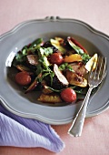 Salad with fried duck breast and peaches