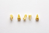 The word 'pasta' spelt out using alphabet pasta shapes