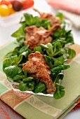 Chicken drumsticks on lamb's lettuce