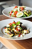 Mediterranean Zucchini Salad with Red Peppers, Red Onion and Feta Cheese; Crab Salad in Background