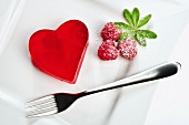 Heart shaped red jello dessert on a plate