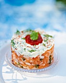 Salmon tartare topped with quark and herbs