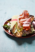 Bruschetta with tomatoes, prosciutto and rocket