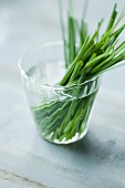Fresh chives in a glass of water