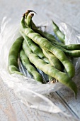 Beans in their pods in a plastic bag