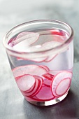 Slices of radish in a glass of water