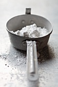 Icing sugar in a saucepan