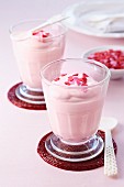 Creamy desserts decorated with sugar hearts