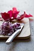 Chopped red onions on a chopping board
