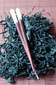 Dried wakame seaweed with chopsticks