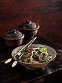 Glass noodle salad with pak choi, beef and nigella seeds