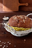 A Loaf of Homemade Oat Bread in a Basket