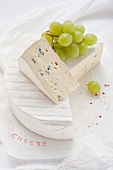 Blue cheese with green grapes
