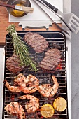 Grilled king prawns and steak on the barbecue grill