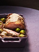 Roast pork with Brussels sprouts, shallots and a creamy sauce