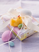 An Easter parcel with a fondant chick and Easter eggs