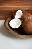 Whole and Halved Coconuts; Coconut Milk in the Halved Coconut