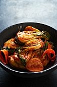A Bowl of Kimchi Made with Fermented Bok Choy, Carrots and Napa Cabbage