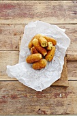 Chicken croquettes on paper