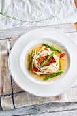 Noodle soup with asparagus and baked salmon (Asia)